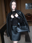 Mid-rise A-Line Buckle Skirt in Black